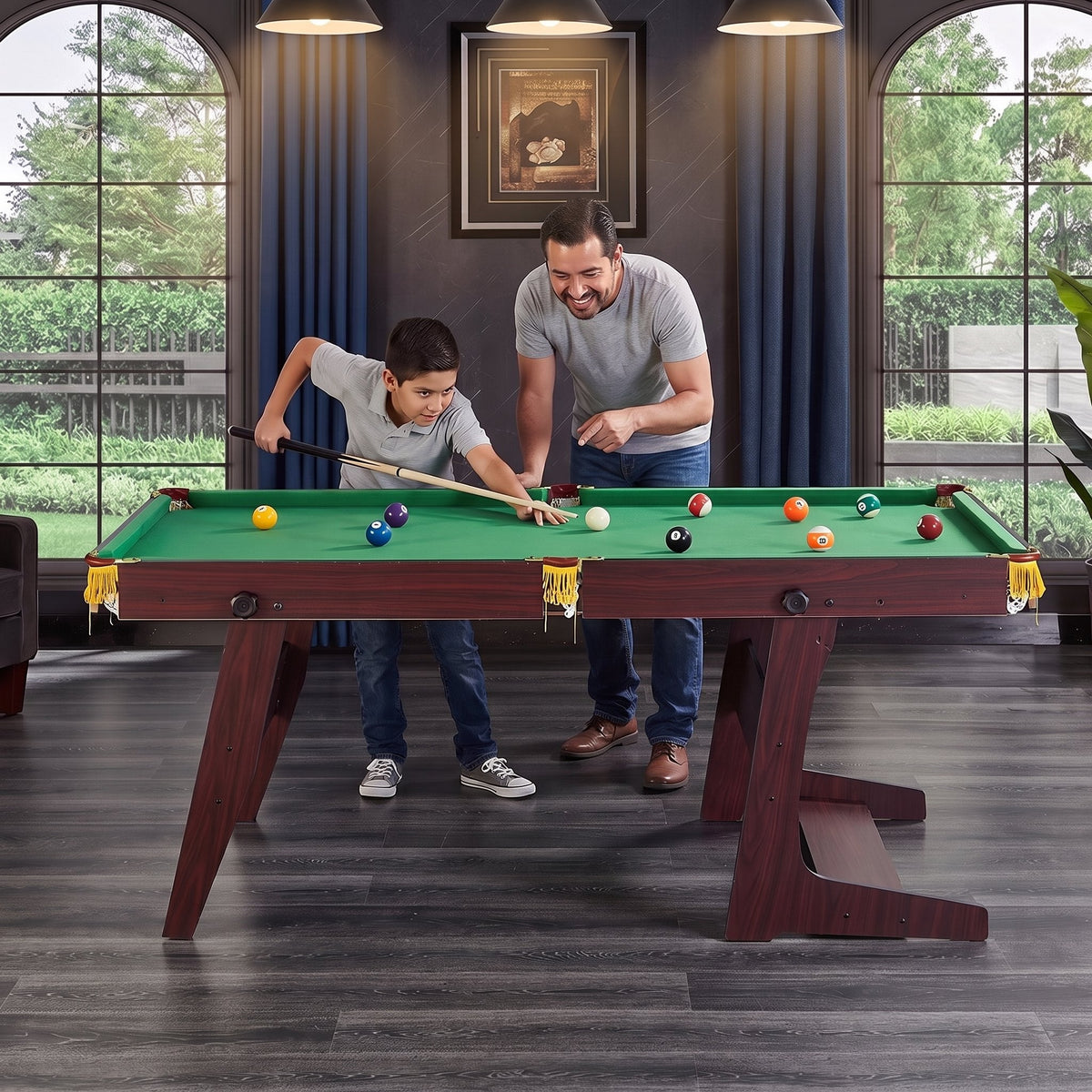 Papá e hijo jugando billar en casa con la mesa plegable BREEZEE de 5 pies